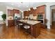 Well-equipped kitchen with stainless steel appliances, granite countertops, and a central island with bar stools at 1305 Chronicle Dr, Durham, NC 27703