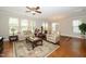 Inviting living room with hardwood floors, large windows, and comfortable seating at 1305 Chronicle Dr, Durham, NC 27703