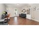 Finished basement with hardwood floors, a sofa, a bookcase, and a desk area at 132 Deardom Way, Chapel Hill, NC 27516