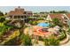 Aerial community view with playground, tables, umbrellas, and building at 132 Deardom Way, Chapel Hill, NC 27516