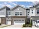 Beautiful townhome exterior with stone accents and attached garage at 132 Deardom Way, Chapel Hill, NC 27516
