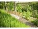 Wooden bridge for residents set in nature among beautiful trees and lush greenery at 132 Deardom Way, Chapel Hill, NC 27516