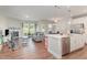 Open concept living space with hardwood floors, fireplace, and seamless flow to the kitchen at 132 Deardom Way, Chapel Hill, NC 27516