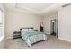 Spacious bedroom with soft carpeting, a tray ceiling, and an ensuite bathroom at 132 Deardom Way, Chapel Hill, NC 27516