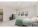 Comfortable bedroom with a tray ceiling, dresser, and a window with a view at 132 Deardom Way, Chapel Hill, NC 27516