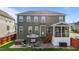 Spacious backyard featuring a patio with a hot tub and outdoor seating at 1320 Abington Dr, Mebane, NC 27302