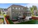 Spacious backyard featuring a patio with a hot tub, stairs to the porch and outdoor seating at 1320 Abington Dr, Mebane, NC 27302