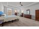 Bedroom with tray ceilings, carpet, a ceiling fan, and lots of dresser and drawer space at 1320 Abington Dr, Mebane, NC 27302