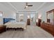 Carpeted bedroom with large windows and dressers at 1320 Abington Dr, Mebane, NC 27302