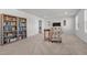 Spacious bonus room with bookshelves and television at 1320 Abington Dr, Mebane, NC 27302