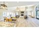 Open community space with dining area, living area with stone fireplace, and ample seating at 1320 Abington Dr, Mebane, NC 27302