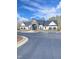 Community building with stone accents, ample parking, and manicured landscaping at 1320 Abington Dr, Mebane, NC 27302