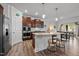 Modern kitchen with stainless steel appliances, granite countertops, and a breakfast bar at 1320 Abington Dr, Mebane, NC 27302