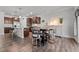 Open-concept kitchen with granite countertops, stainless steel appliances, and a cozy breakfast nook at 1320 Abington Dr, Mebane, NC 27302