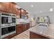 Gourmet kitchen with stainless steel appliances, granite counters, and a breakfast bar at 1320 Abington Dr, Mebane, NC 27302