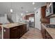 Bright kitchen with stainless steel appliances, granite countertops, and ample cabinet space at 1320 Abington Dr, Mebane, NC 27302