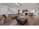 Spacious living room with hardwood floors and an open floorplan leading to the kitchen at 1320 Abington Dr, Mebane, NC 27302