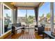 Relaxing screened-in porch with wood flooring, outdoor seating and neighborhood views at 1320 Abington Dr, Mebane, NC 27302