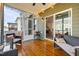 Relaxing screened-in porch with wood flooring, outdoor seating and overhead lighting at 1320 Abington Dr, Mebane, NC 27302
