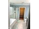 Well-lit bathroom with a glass-enclosed shower and a view into the walk-in closet at 1320 Double Oak Ln, Willow Springs, NC 27592