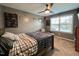 This bedroom includes a ceiling fan, accents and natural light from the window at 1320 Double Oak Ln, Willow Springs, NC 27592