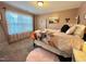 Cozy bedroom featuring soft textures, a four-poster bed, and natural light from the window at 1320 Double Oak Ln, Willow Springs, NC 27592
