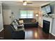 Comfortable living room with a fireplace and a large sectional couch, perfect for relaxing and entertaining at 1320 Double Oak Ln, Willow Springs, NC 27592