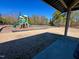 Community playground area featuring a slide, climbing structure, and swing set for recreational fun at 1320 Double Oak Ln, Willow Springs, NC 27592