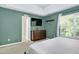 Bedroom showing TV, window, furnishings and decor at 136 River Pearl St, Raleigh, NC 27603