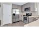 Well-equipped kitchen with stainless steel appliances, ample cabinetry, and modern flooring at 136 River Pearl St, Raleigh, NC 27603