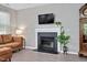 Close up view of cozy living room featuring a fireplace and grandfather clock at 136 River Pearl St, Raleigh, NC 27603