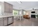Open living space with a fireplace, dining area, and seamless flow from the kitchen at 136 River Pearl St, Raleigh, NC 27603