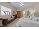 Bedroom with neutral carpet, a ceiling fan and seating near a large window at 1415 Meadow Wind Ln, Hillsborough, NC 27278