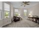Bedroom featuring neutral carpet, a ceiling fan and natural lighting from two large windows at 1415 Meadow Wind Ln, Hillsborough, NC 27278