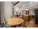 Open-concept dining area adjacent to the kitchen, showcasing a wooden table and views of the living space at 1415 Meadow Wind Ln, Hillsborough, NC 27278