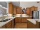 Kitchen showcases wooden cabinetry, granite countertops, stainless steel appliances, and center island at 1415 Meadow Wind Ln, Hillsborough, NC 27278