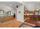 Open concept kitchen with custom cabinets, granite countertops, and breakfast bar seating at 1415 Meadow Wind Ln, Hillsborough, NC 27278