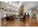 Spacious living room boasts hardwood floors, vaulted ceilings, fireplace, and ample natural light at 1415 Meadow Wind Ln, Hillsborough, NC 27278