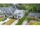 Aerial view of a white, two-story home with well-manicured landscaping at 1422 Banbury Rd, Raleigh, NC 27607