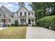 Charming two-story home with a manicured lawn and mature landscaping at 1422 Banbury Rd, Raleigh, NC 27607
