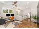 Home office with hardwood floors, natural light, and a modern desk at 1422 Banbury Rd, Raleigh, NC 27607