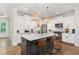 Gourmet kitchen with marble countertops, stainless steel appliances, and a center island with seating at 1422 Banbury Rd, Raleigh, NC 27607