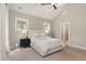 Bedroom with neutral walls, ceiling fan, carpet flooring, and natural light at 1422 Banbury Rd, Raleigh, NC 27607