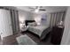 Serene bedroom with calming grey tones, a ceiling fan, and soft lighting, perfect for relaxation at 1436 Sedwick Rd, Durham, NC 27713