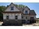 Two-story home with a mix of brick and siding, showcasing its architectural details at 1611 S Old Carriage Rd, Rocky Mount, NC 27804