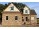 Charming brick home with a classic design featuring a gable roof and large windows at 1611 S Old Carriage Rd, Rocky Mount, NC 27804