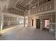 Bright living room with high ceilings and large windows, ready for customization at 1611 S Old Carriage Rd, Rocky Mount, NC 27804