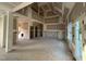 Open-concept living area featuring ample space and natural light, ready for finishing touches at 1611 S Old Carriage Rd, Rocky Mount, NC 27804