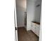 Incomplete bathroom featuring a vanity with cabinetry and a doorway leading to a shower space at 200 Green Pines Estates Dr, Kenly, NC 27542