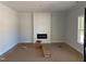 Living room showcases a modern fireplace feature wall and sleek, unfinished flooring awaiting final touches at 200 Green Pines Estates Dr, Kenly, NC 27542